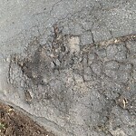 Pothole at Rainbow Ln